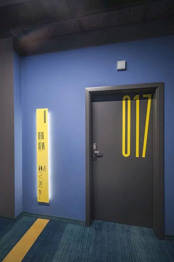 Corridor and floor signage with printed, contour-cut stickers — QLTY