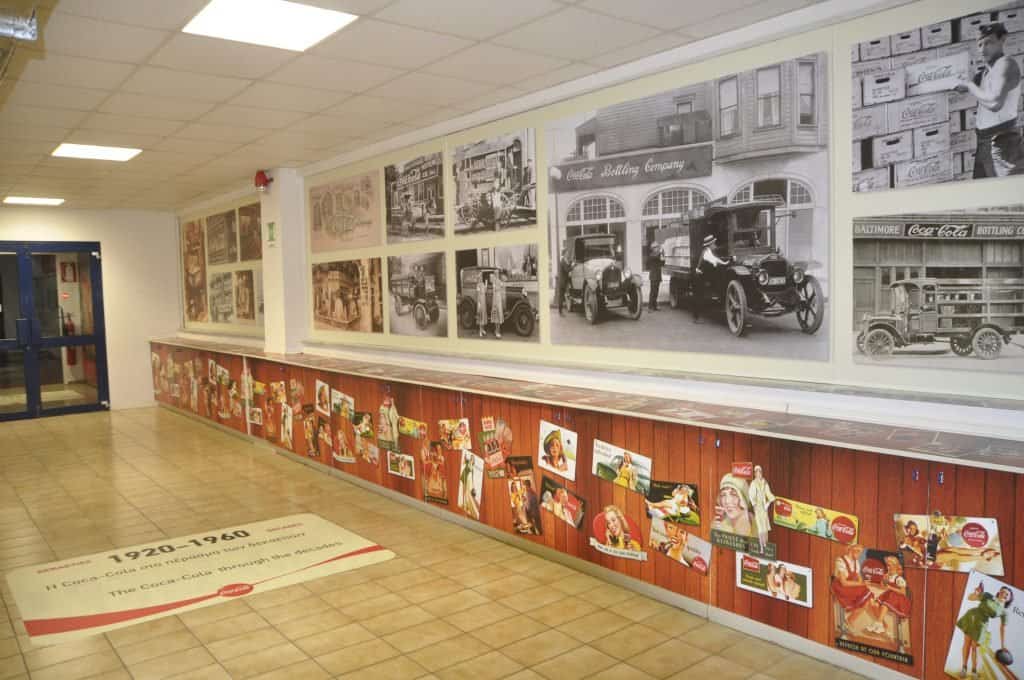 Long historical mural in a corporate corridor, printed on adhesive vinyl