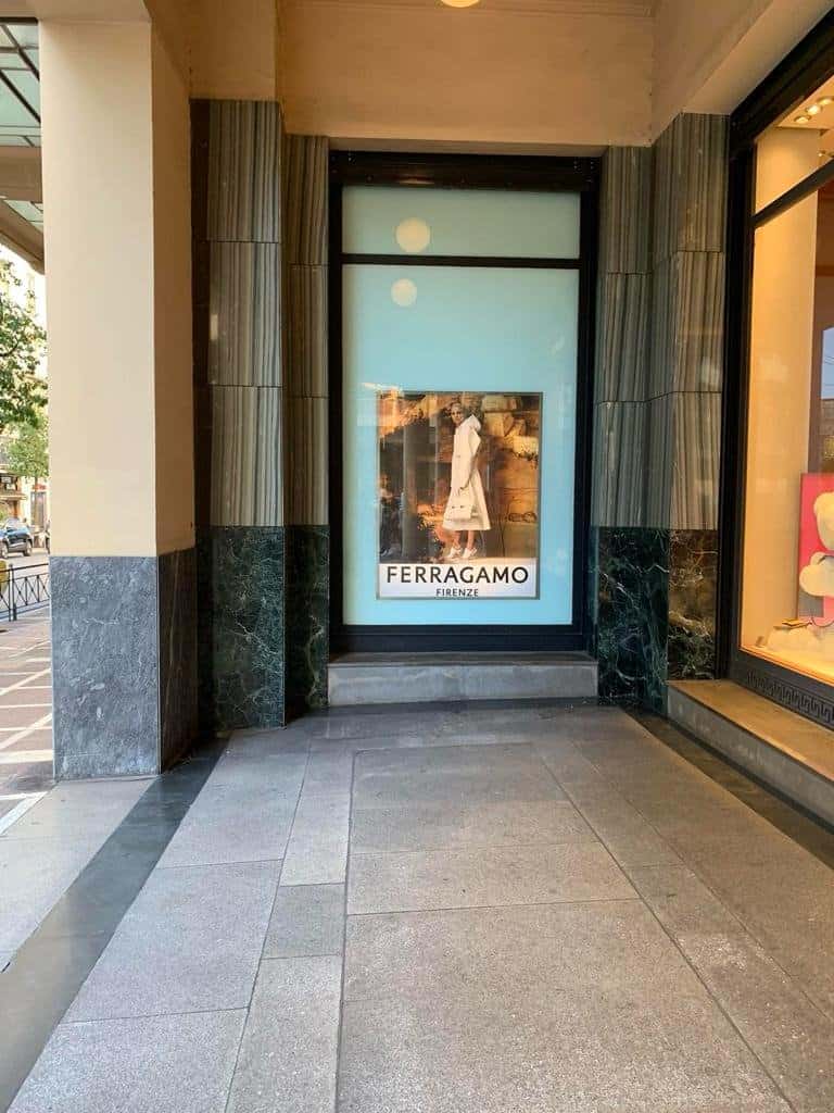 Large-format Ferragamo poster in an illuminated shop window