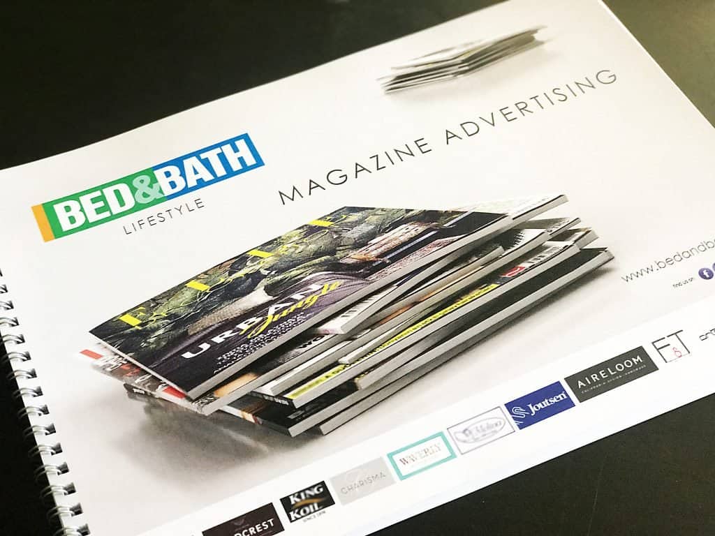 Stack of digitally printed promotional magazines on matt paper