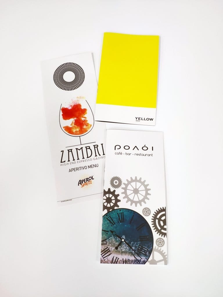 Flat lay of a digitally printed restaurant menu and colour swatches