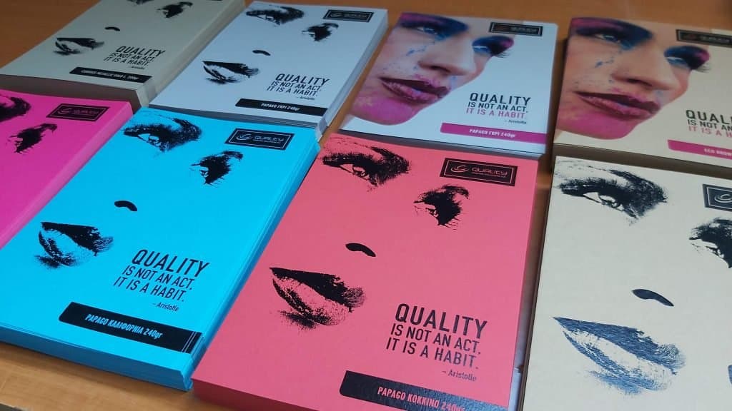 Stacks of digitally printed covers in fuchsia, light blue and grey